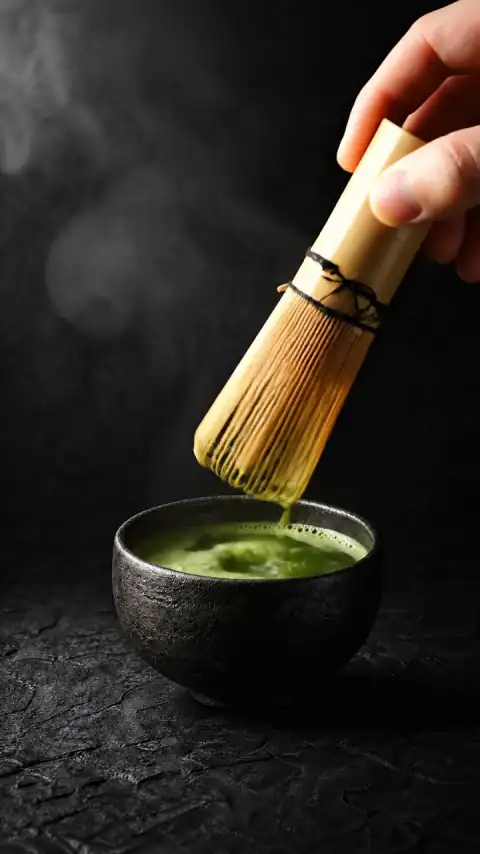 Matcha being whisked in the bowl