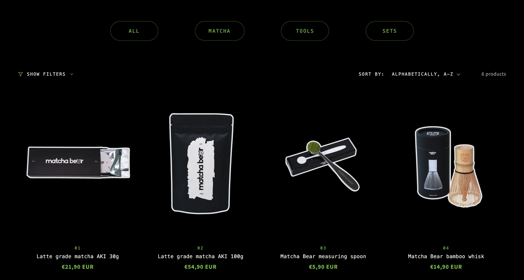 The shop page on a computer: four round buttons All, Matcha, Tools and Sets, the filter and sort line with "6 products", and the first row of four numbered products with their prices: AKI 30g, AKI 100g, measuring spoon and bamboo whisk.